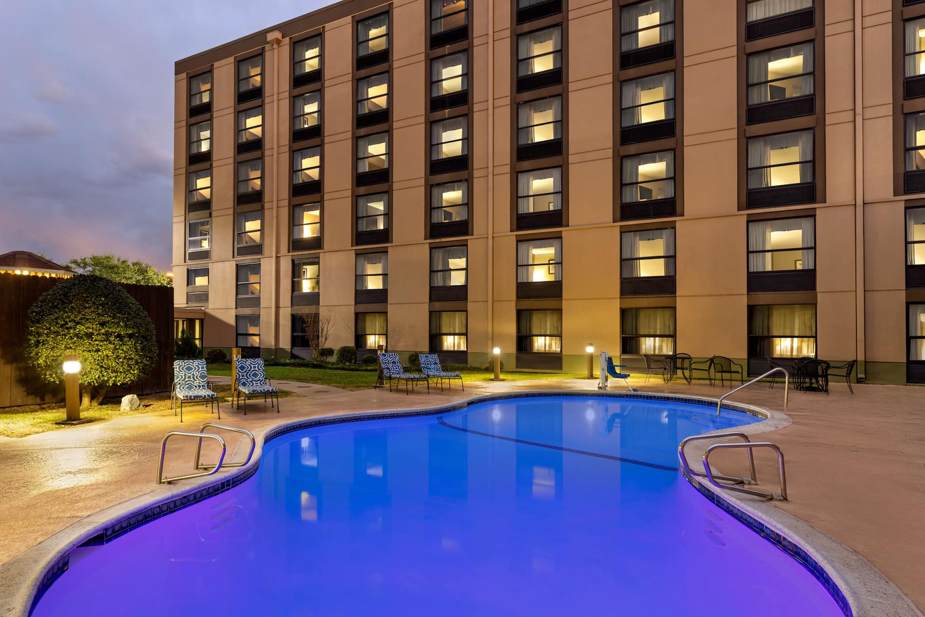 The Dallasonian hotel building with a view of the pool