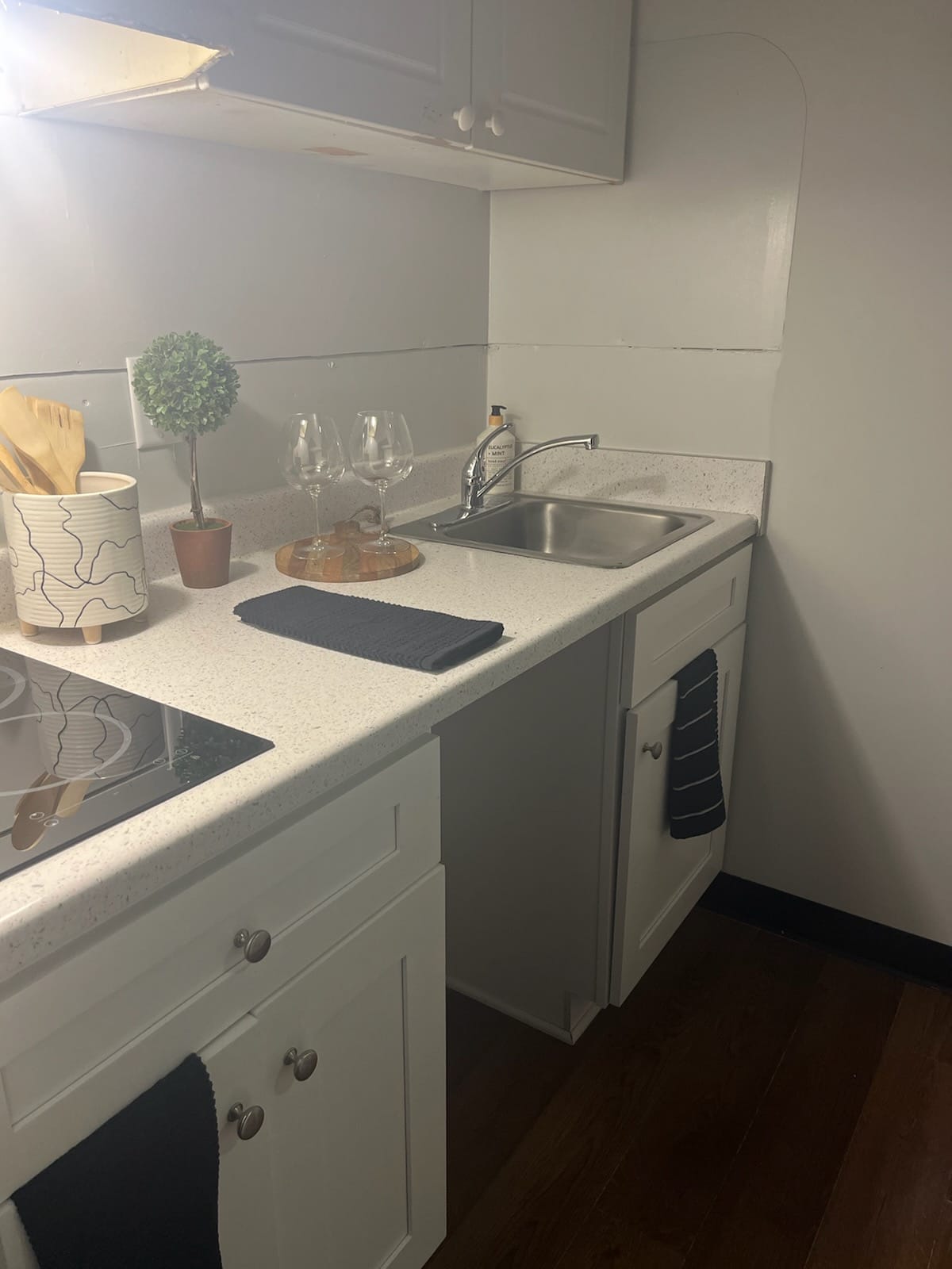 a kitchen area inside a Midtown Village room